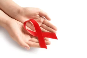 Red awareness ribbon representing Oral Cancer awareness and preventive care