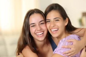 Smiling patients together, representing confidence after Cosmetic Dentistry