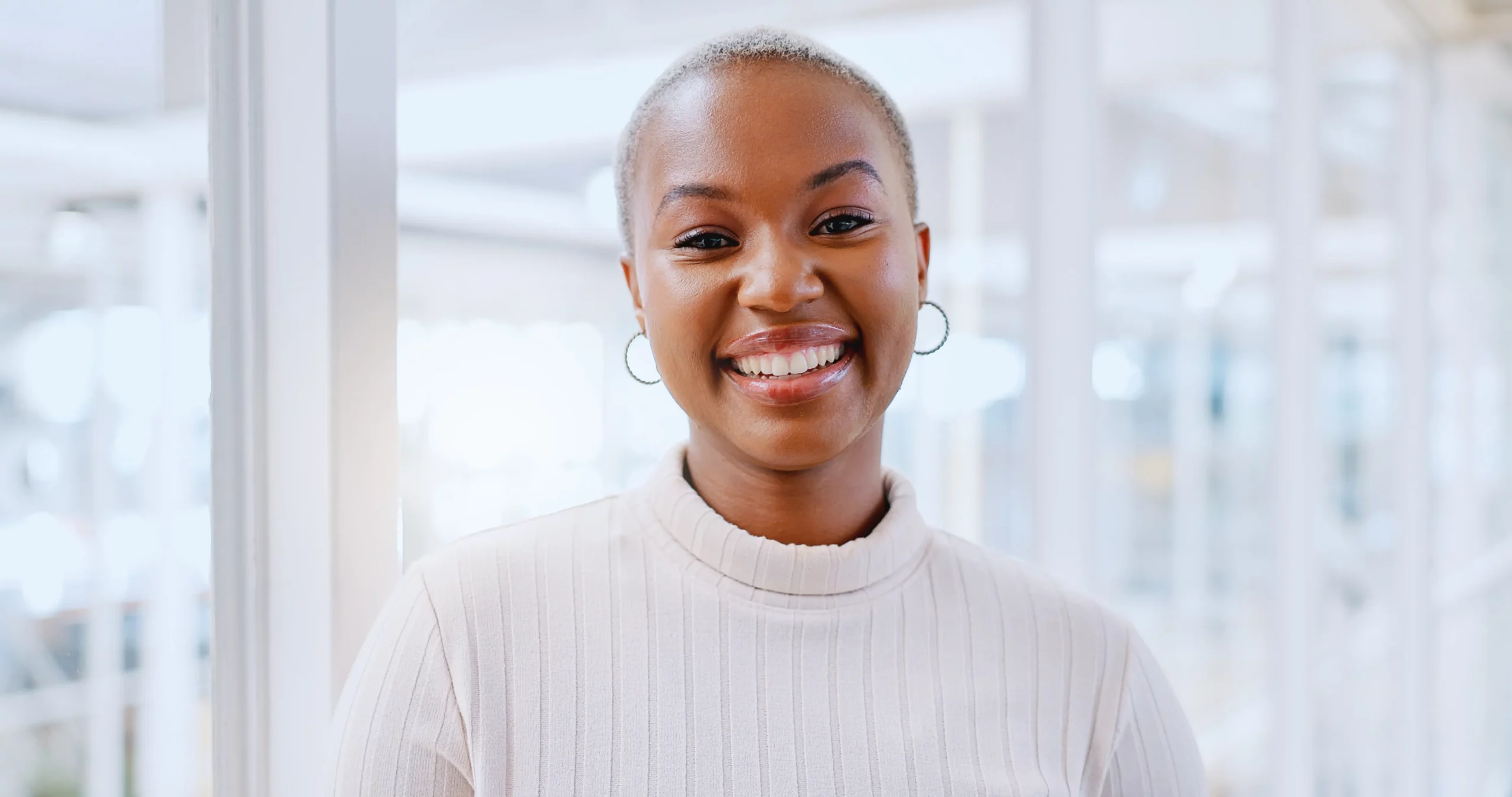 Smiling woman laughing, representing confidence after dental treatment in Spirit Lake IA